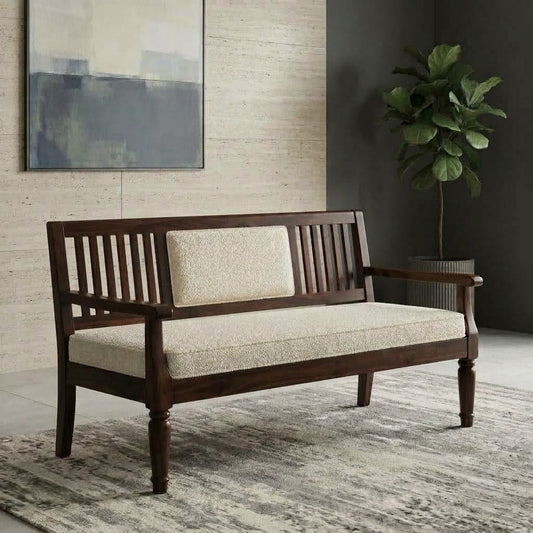 Crème boucle upholstered wooden bench with curved arms and slatted backrest