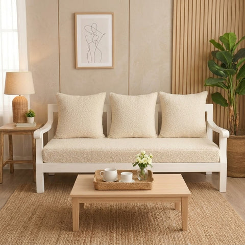Crème boucle 3 seater sofa styled with cushions in modern living room