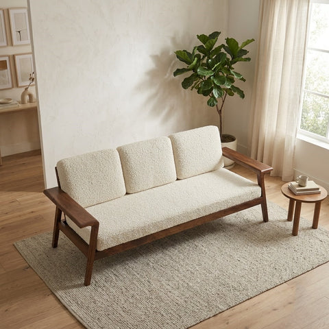 Beige bouclé upholstered three seater wooden sofa with solid Sheesham wood frame