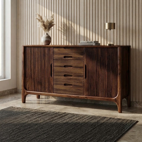 Bring timeless elegance to your living room with the PRITI Premium Wooden Sideboard and Cabinet. Crafted from solid Sheesham wood with a rich walnut finish, this spacious storage unit combines hinged-door cabinets and drawers to keep your space organized and stylish.