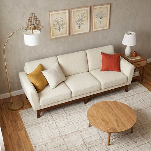 Close-up of Crème Boucle textured upholstery on wooden sofa frame
