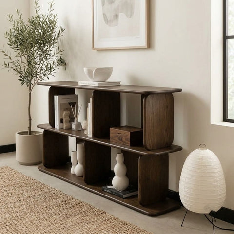 Close-up of curved wooden support posts on a dark walnut display console