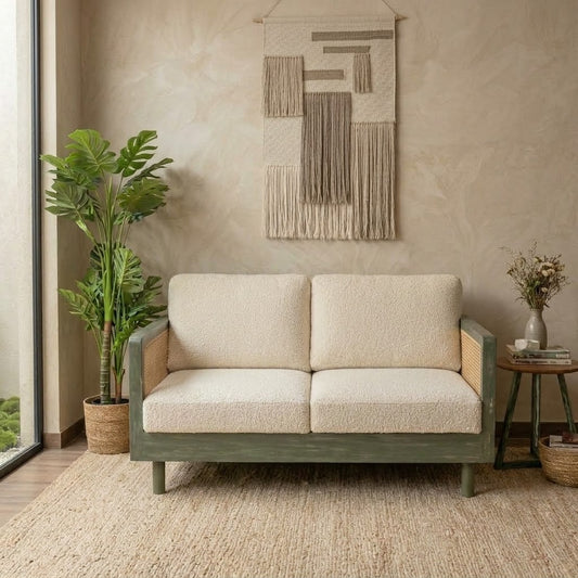 Mango wood living room sofa with cane side panels and boucle fabric