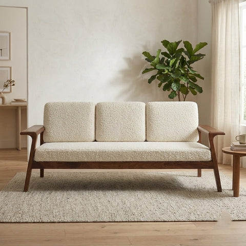 Modern cream bouclé sofa with natural Sheesham wood arms and legs