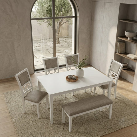 Rectangular white dining table with four fabric chairs and matching bench