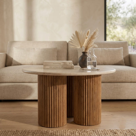 Round wooden coffee table with fluted base