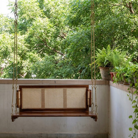 Sheesham wood hanging swing with decorative cane backrest for home