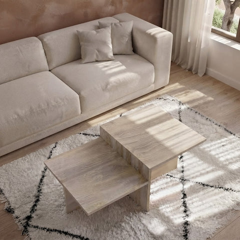 Split-level travertine coffee table styled on a Moroccan diamond rug