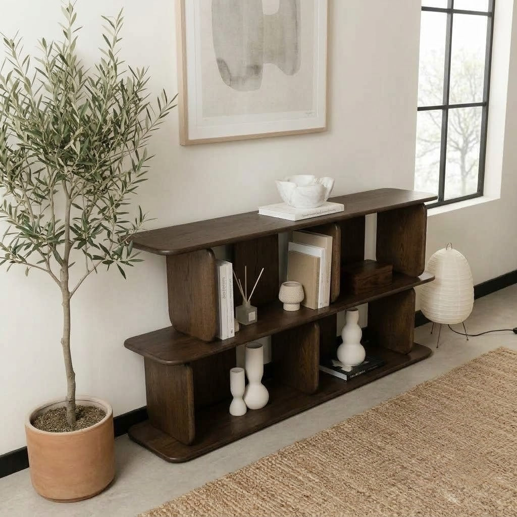 Two-tier open bookshelf in espresso wood finish beneath an abstract framed art print