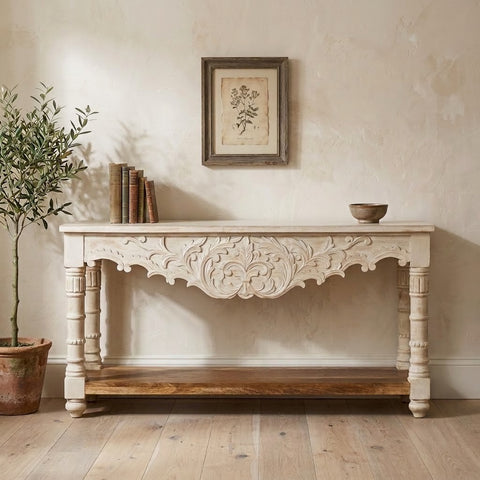 Vintage whitewashed wooden console table with intricate floral carvings